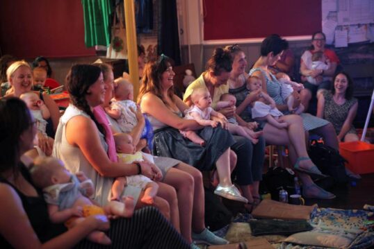 Aftermirth audience laughing with babies on their laps, at Tobacco Factory Theatres